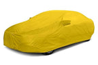 All weather car cover, yellow, snug fit over parked vehicle
