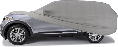 Gray all-weather car cover draped over car body and wheels