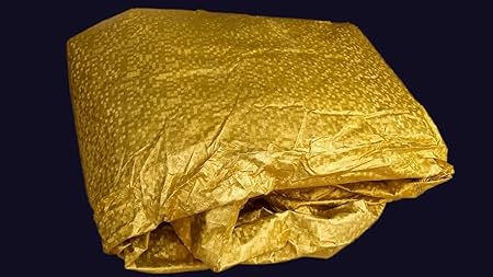 All-weather car cover fabric, gold yellow textured cover folded and creased