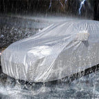 All weather car cover, metallic silver, covered vehicle in rain with water beading