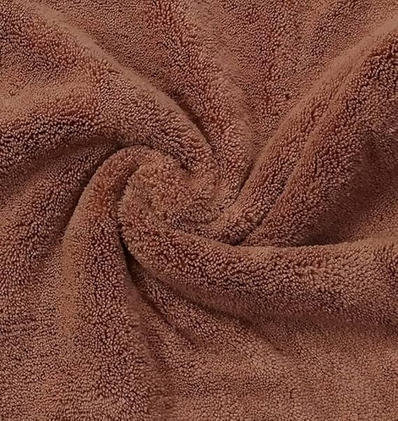 Close-up of thick brown microfiber cleaning cloth with plush texture