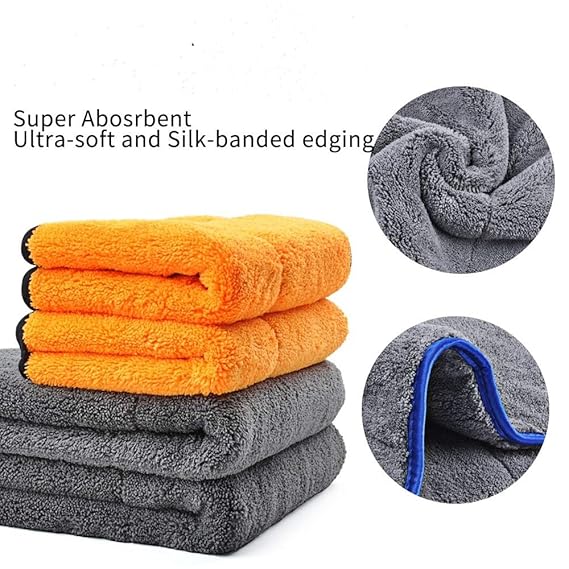 Stack of double-sided microfiber towels, orange and gray with silk-banded edging.